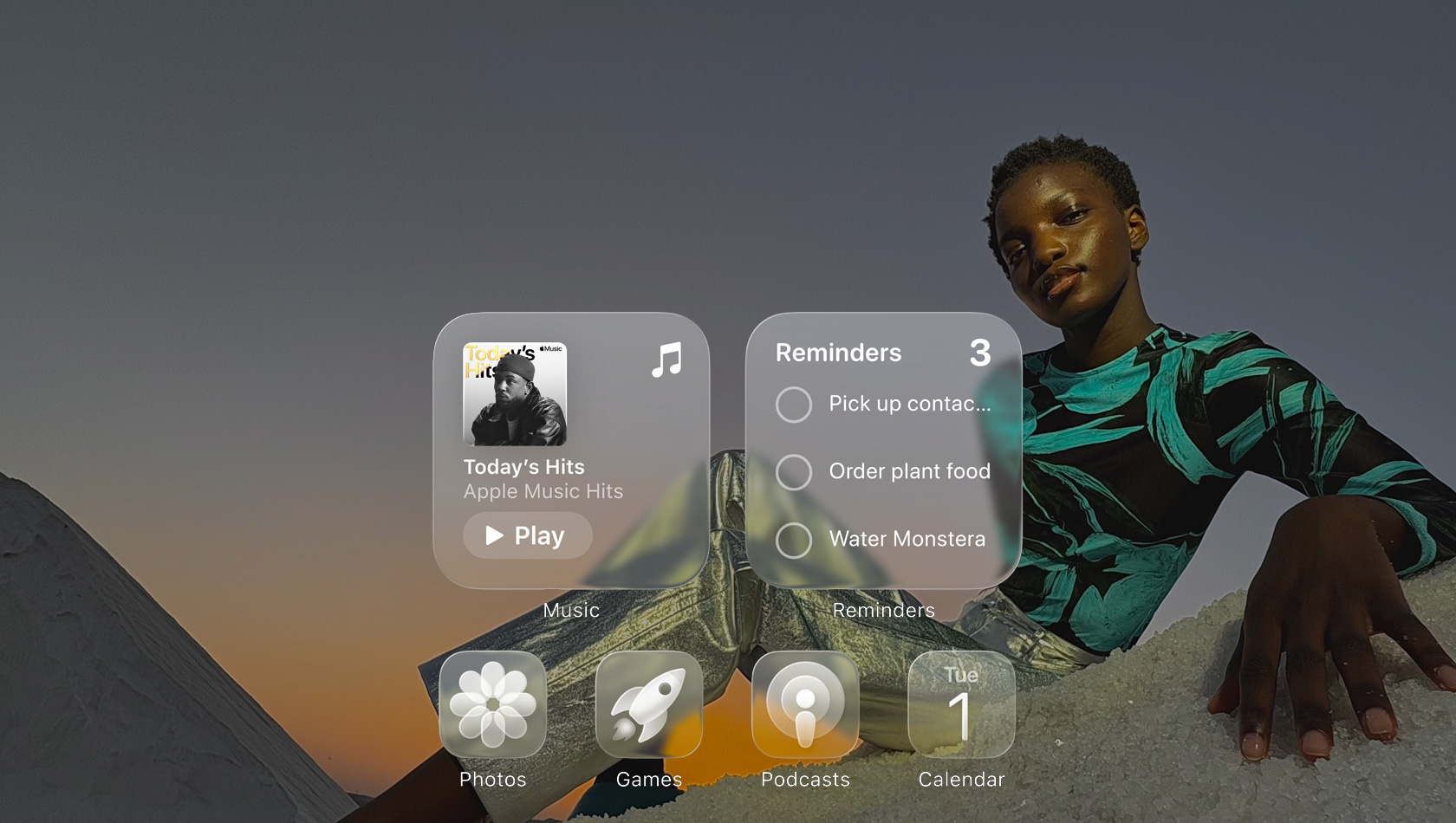 Liquid Glass display with clear app icons, like Apple Music, Reminders, Photos, Games, Podcasts, and FaceTime refracting against the wallpaper