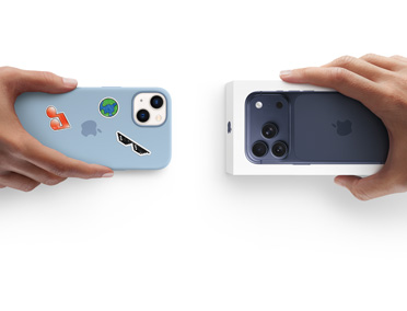 Hands exchanging trade-in. iPhone 13 with Silicon cover, stickers on back exterior for new iPhone 17 in the box.