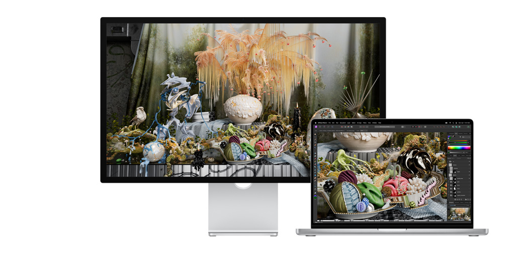 14-inch MacBook Pro alongside Studio Display showing a project in Affinity Photo.